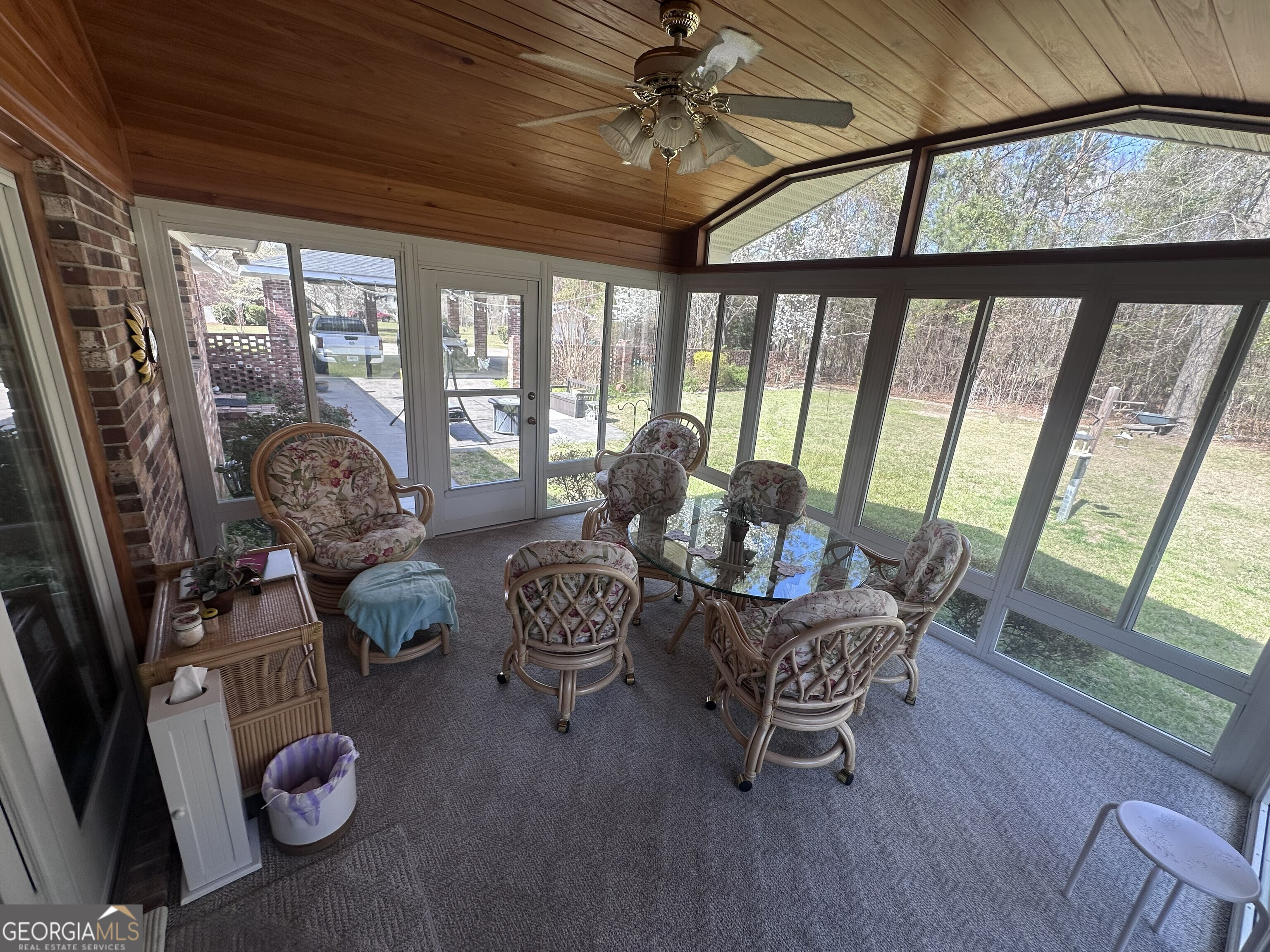 108 Sitton Avenue Gordon, GA 31031 - Photo 2 of 6 a living room with furniture and a floor to ceiling window