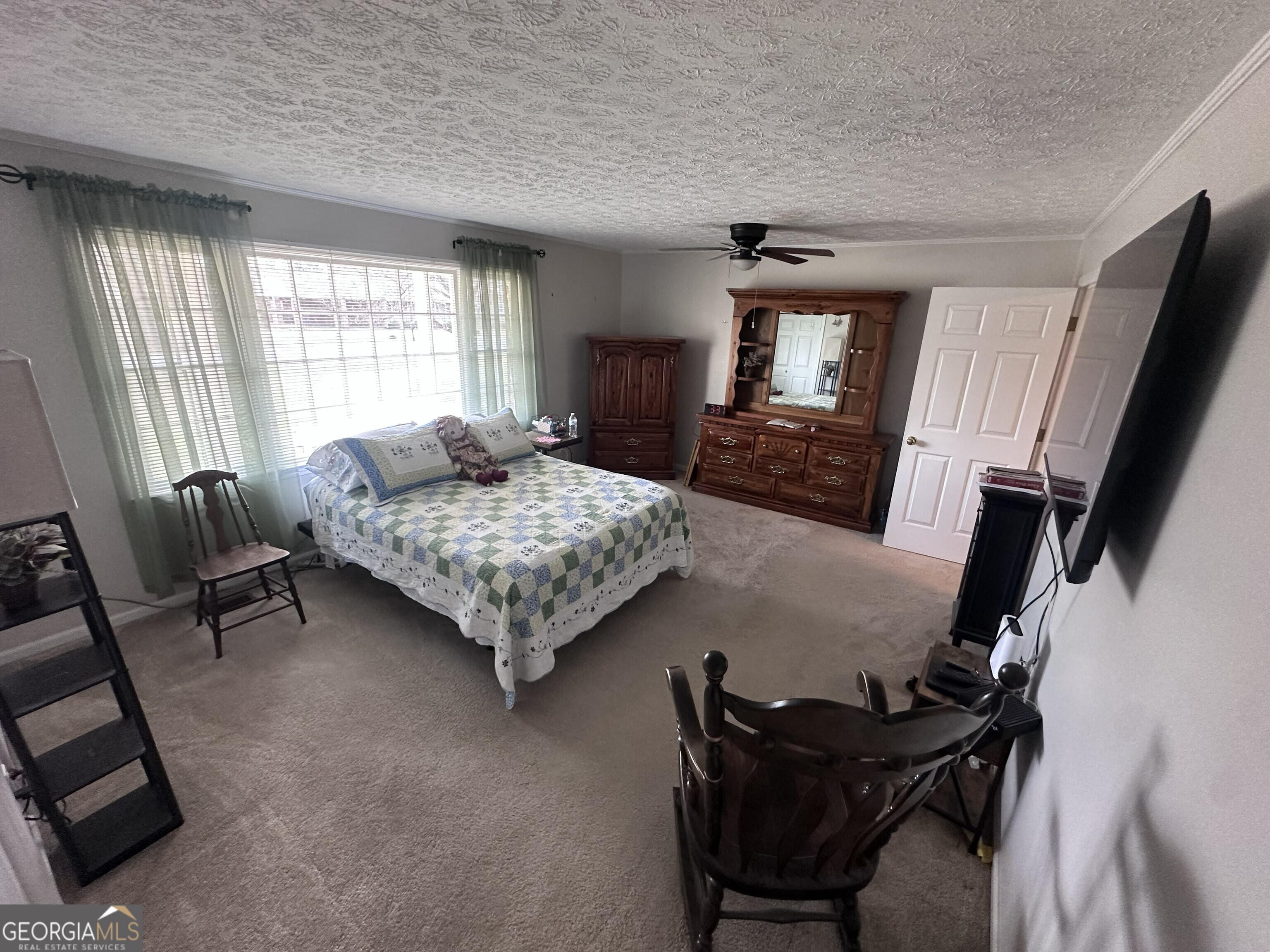 108 Sitton Avenue Gordon, GA 31031 - Photo 5 of 6 a living room with furniture and a flat screen tv