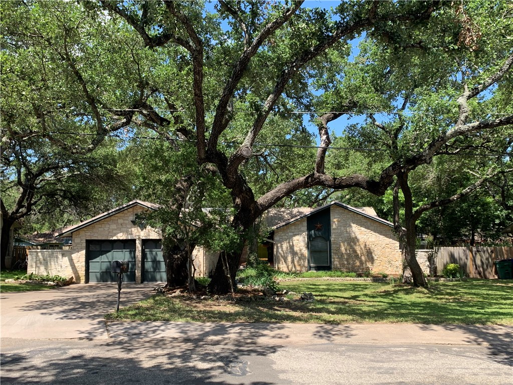 a house with a tree in front of it