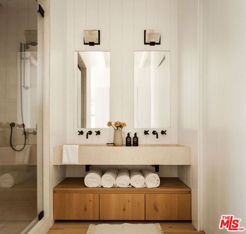 a bathroom with a light fixture and a sink