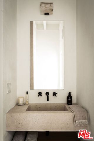 a kitchen with a table and chairs