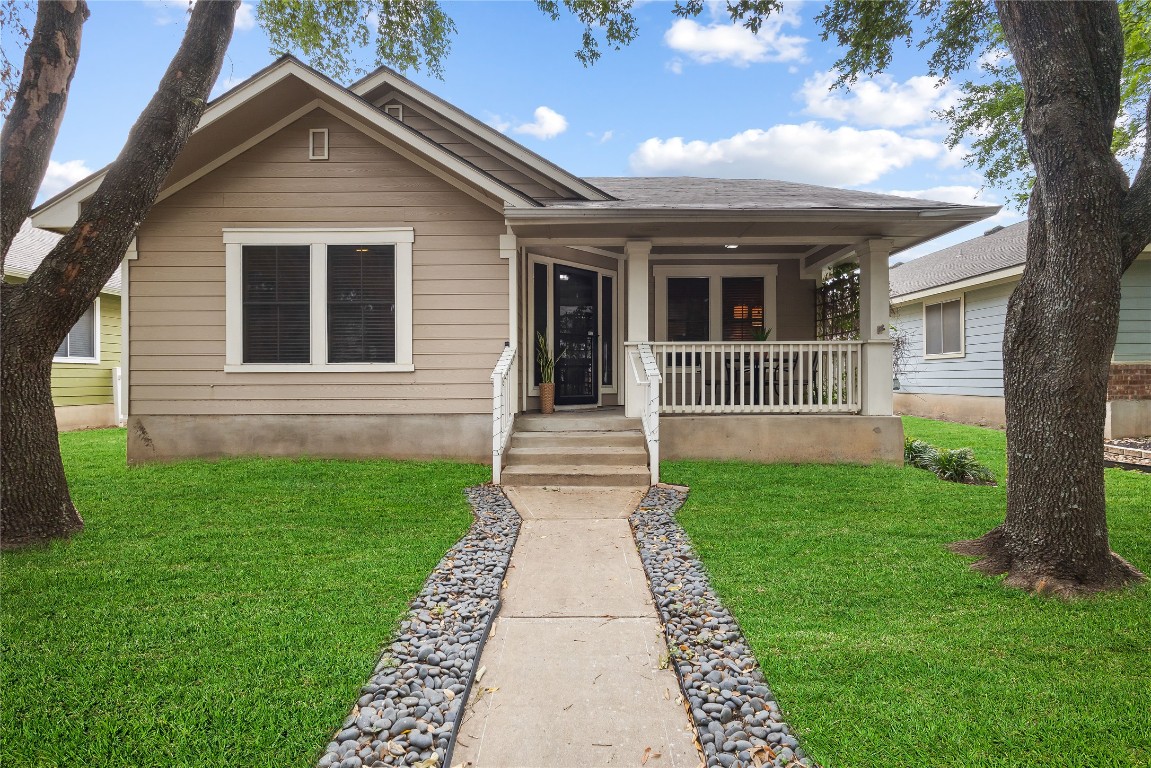 a front view of a house with garden