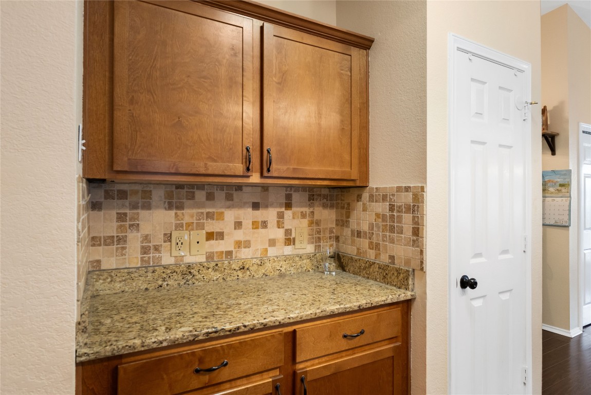 317 Strawn Kyle, TX 78640 - Photo 14 of 38 a bathroom with a granite countertop sink and a mirror