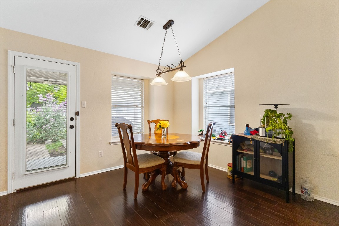 317 Strawn Kyle, TX 78640 - Photo 18 of 38 a view of a dining room with furniture window and wooden floor