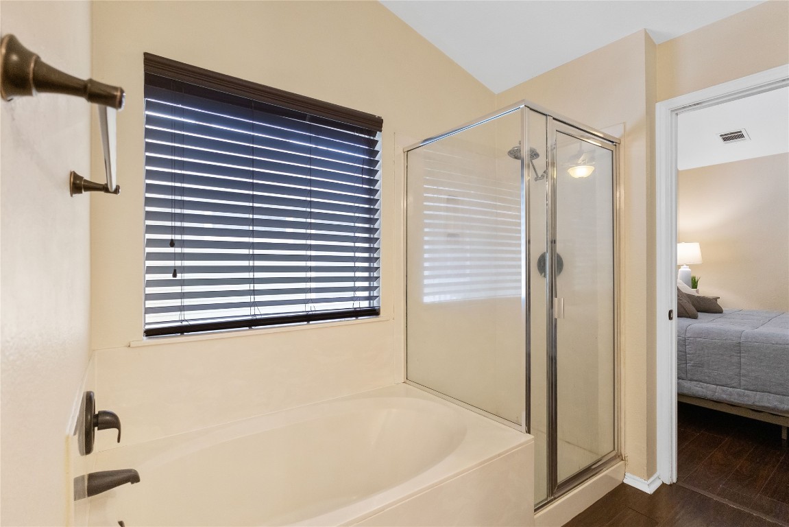 317 Strawn Kyle, TX 78640 - Photo 21 of 38 a bathroom with a bathtub and a shower