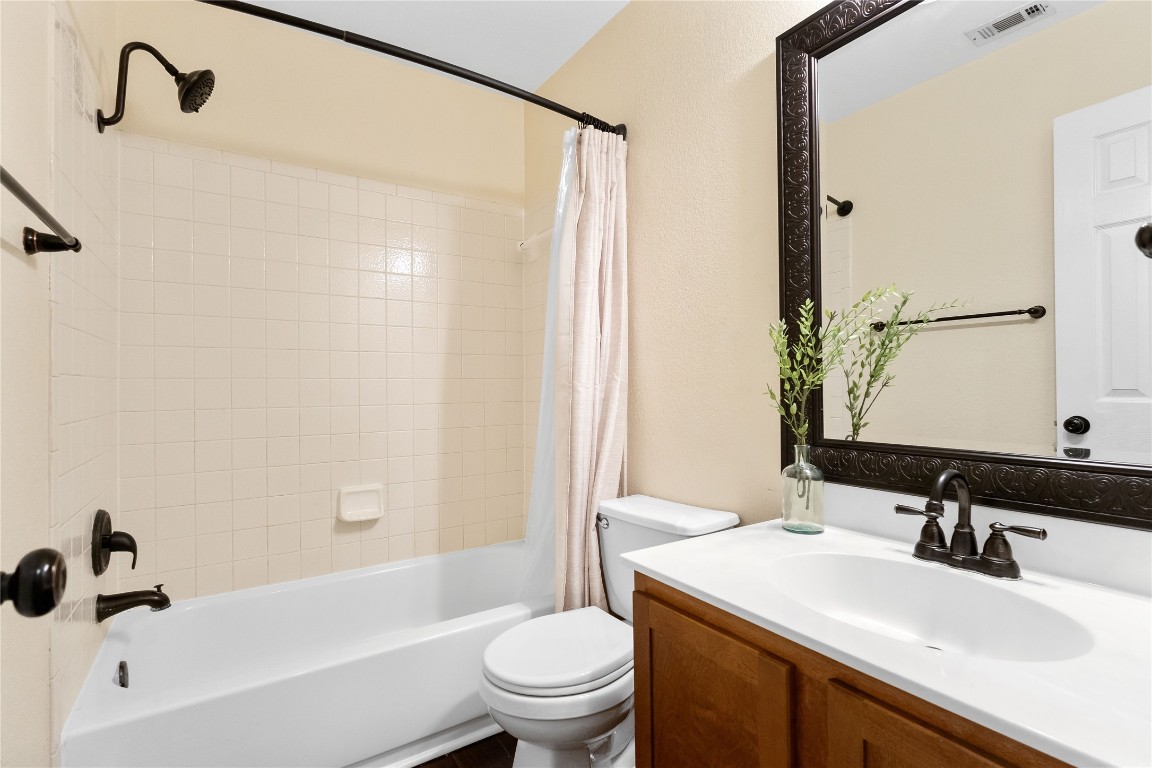 317 Strawn Kyle, TX 78640 - Photo 26 of 38 a bathroom with a sink toilet and shower