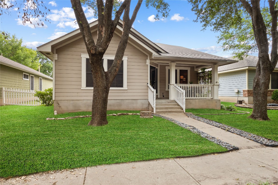 317 Strawn Kyle, TX 78640 - Photo 4 of 38 a front view of a house with a garden