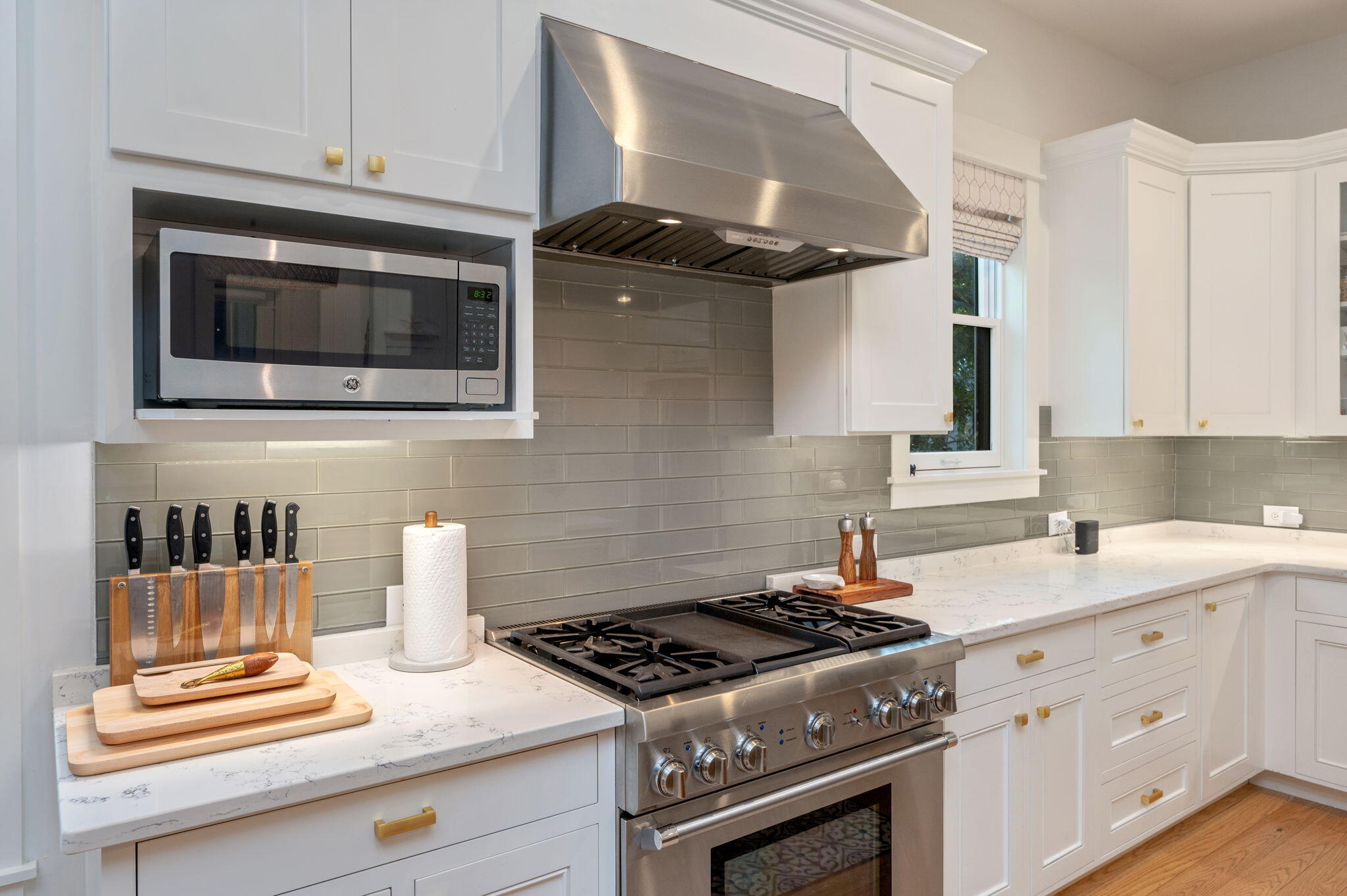 60 Red Cedar Way Santa Rosa Beach, FL 32459 - Photo 15 of 75 a kitchen with stainless steel appliances a stove and white cabinets