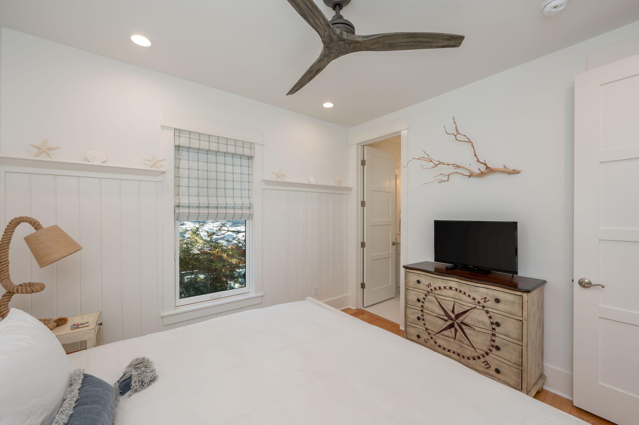 60 Red Cedar Way Santa Rosa Beach, FL 32459 - Photo 62 of 75 a bedroom with a bed and a flat screen tv