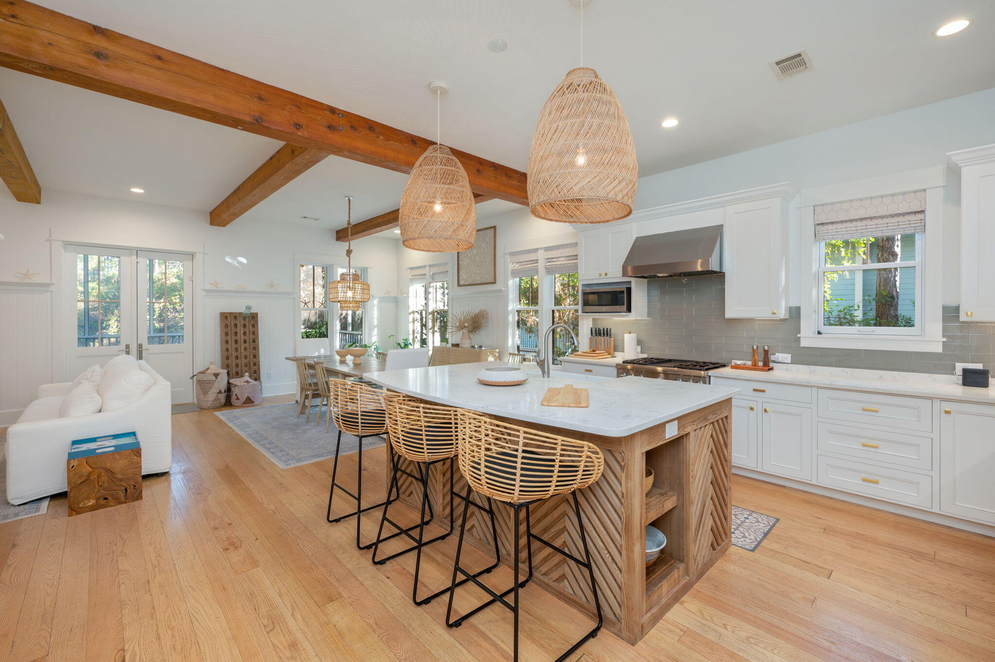 60 Red Cedar Way Santa Rosa Beach, FL 32459 - Photo 9 of 75 a open kitchen with stainless steel appliances granite countertop a stove and a wooden floors
