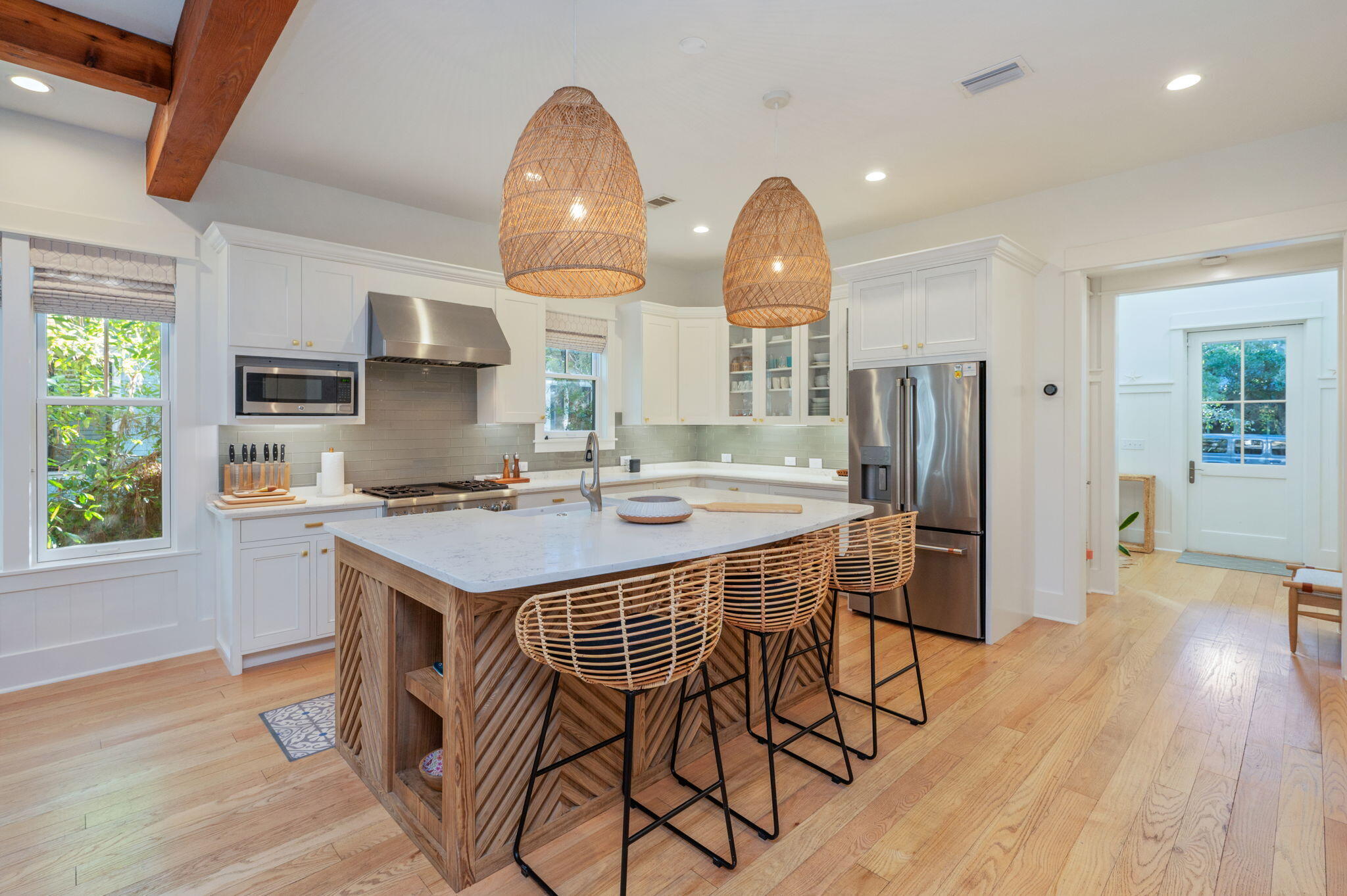 60 Red Cedar Way Santa Rosa Beach, FL 32459 - Photo 10 of 75 a kitchen with stainless steel appliances a dining table and chairs
