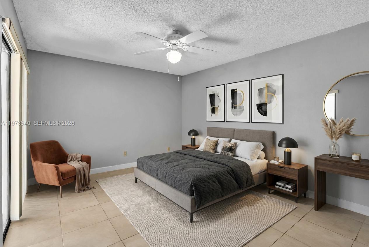 3252 Foxcroft Road, Unit 102 Miramar, FL 33025 - Photo 12 of 34 Staged Master Bedroom