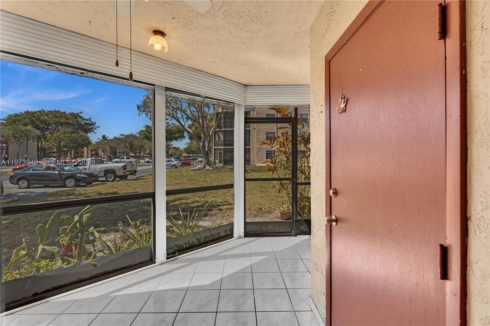 3252 Foxcroft Road, Unit 102 Miramar, FL 33025 - Photo 23 of 34 Screened Patio