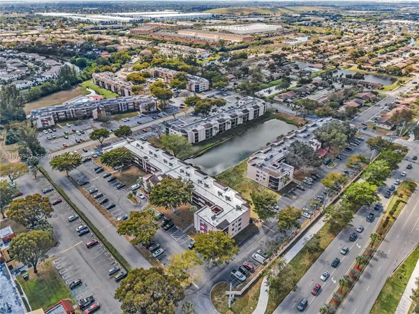 an aerial view of a house with a lake view