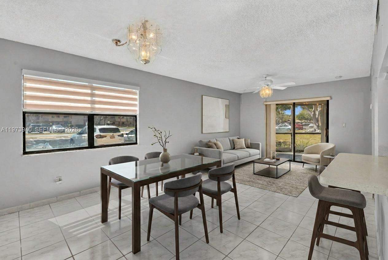 3252 Foxcroft Road, Unit 102 Miramar, FL 33025 - Photo 6 of 34 Staged Living/Dining Area