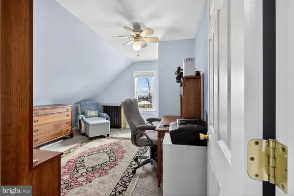 a view of living room with furniture and a window