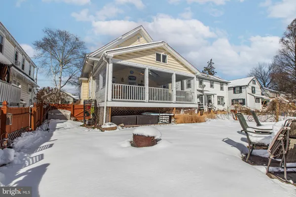 a view of a house with sitting area and garden
