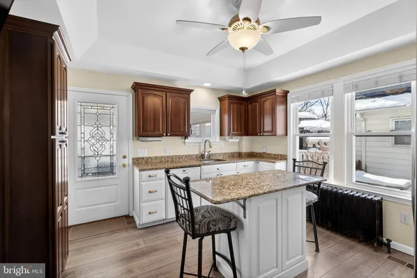 a kitchen with a counter space cabinets and appliances
