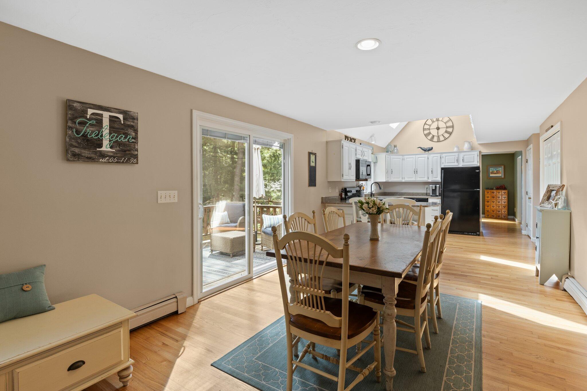 131 Clamshell Cove Road Cotuit, MA 02635 - Photo 18 of 67 a view of a dining room with furniture and wooden floor