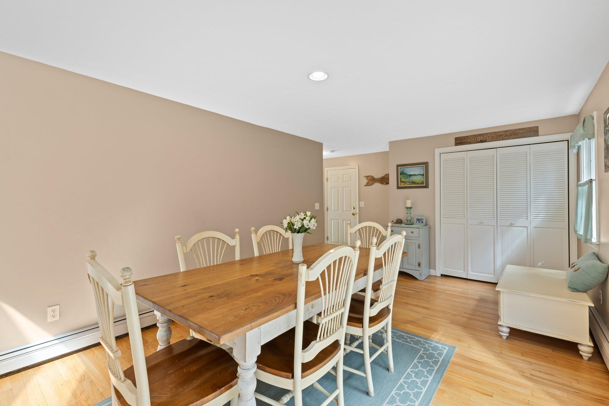 131 Clamshell Cove Road Cotuit, MA 02635 - Photo 20 of 67 a dining room with furniture and wooden floor