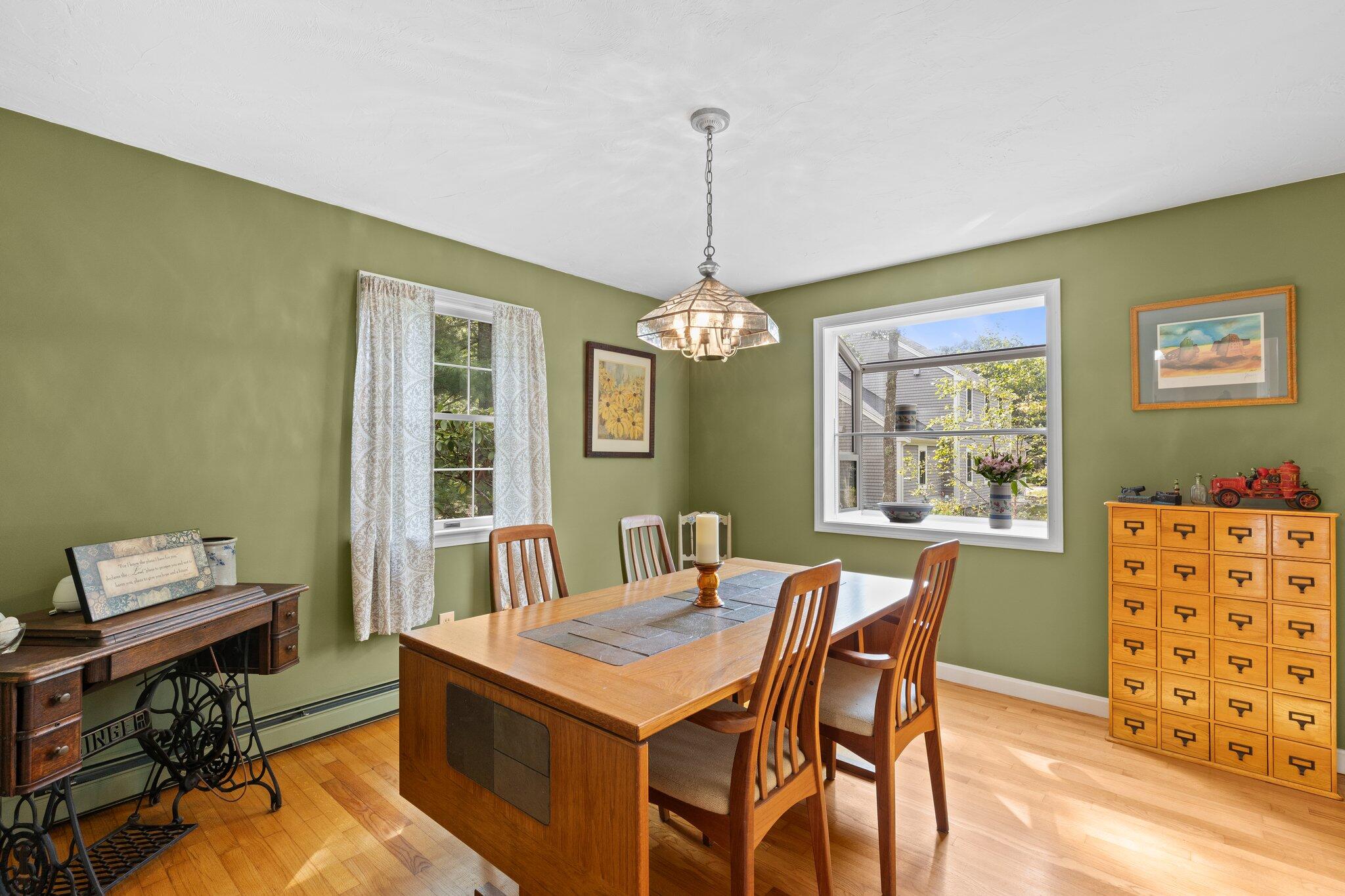 131 Clamshell Cove Road Cotuit, MA 02635 - Photo 23 of 67 a view of a dining room with furniture window and wooden floor