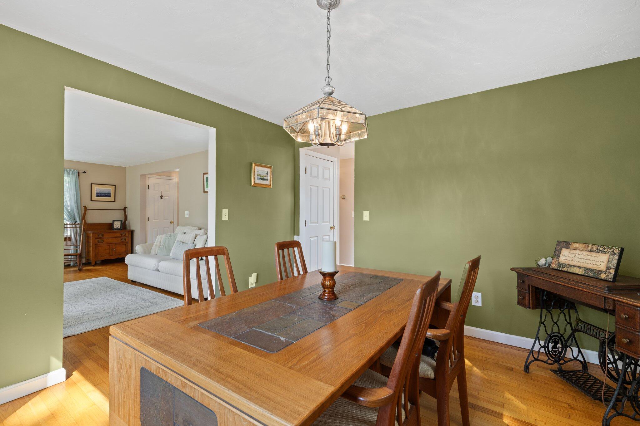 131 Clamshell Cove Road Cotuit, MA 02635 - Photo 24 of 67 a view of a dining room with furniture and wooden floor