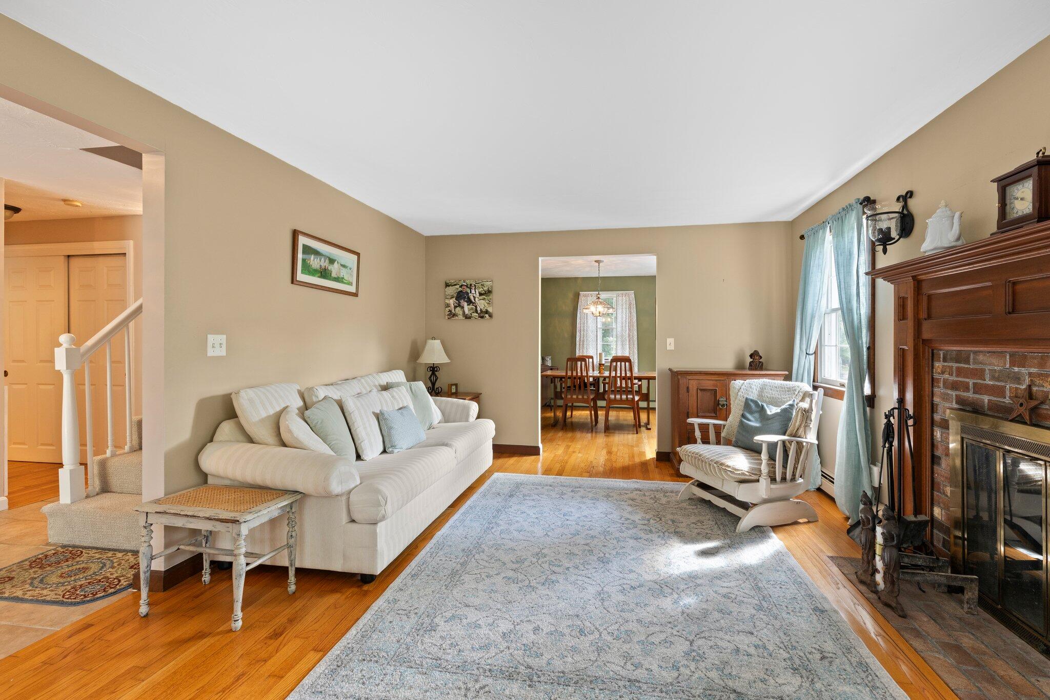 131 Clamshell Cove Road Cotuit, MA 02635 - Photo 27 of 67 a living room with furniture window and a flat screen tv