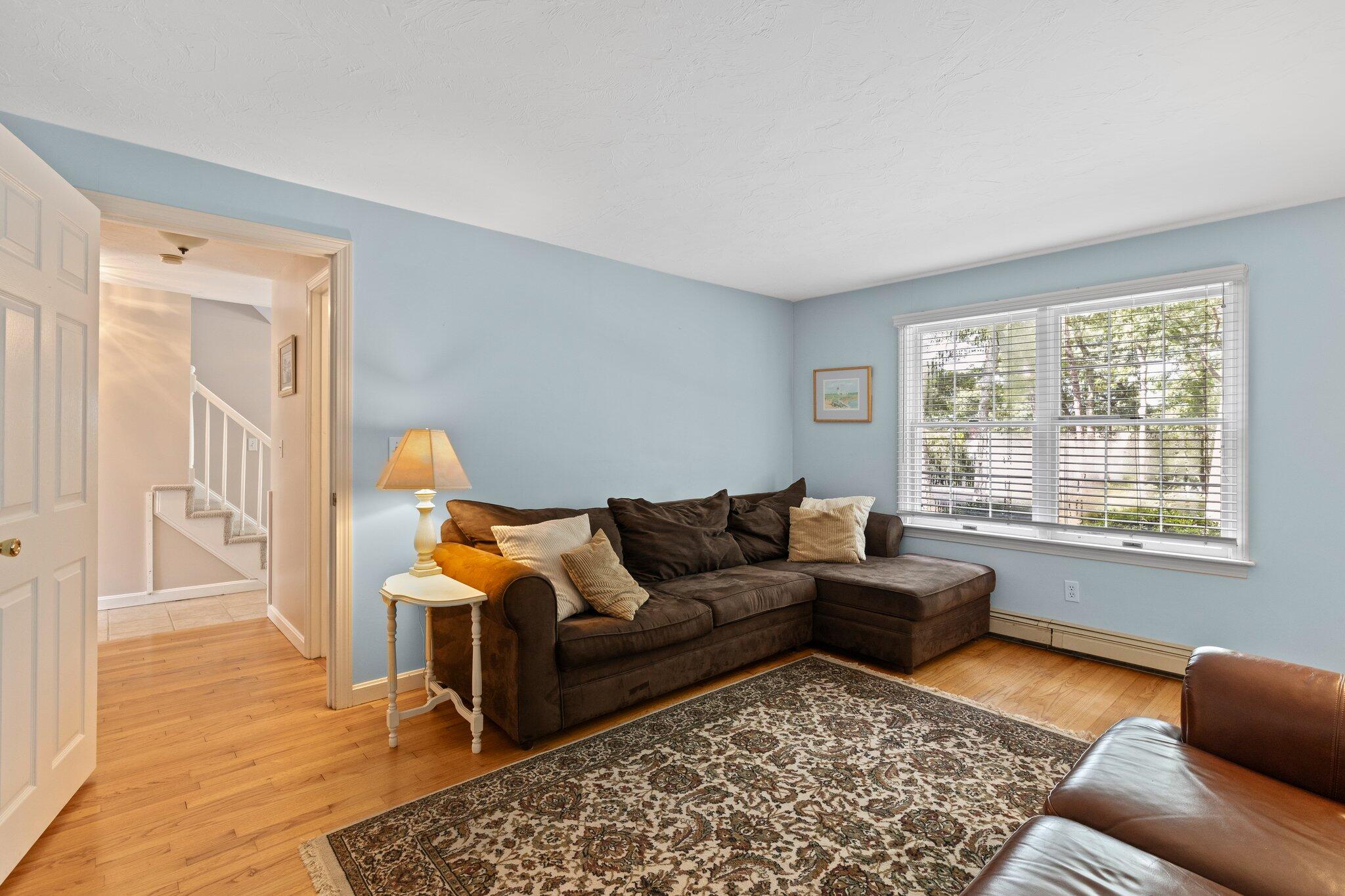 131 Clamshell Cove Road Cotuit, MA 02635 - Photo 30 of 67 a living room with furniture and a rug