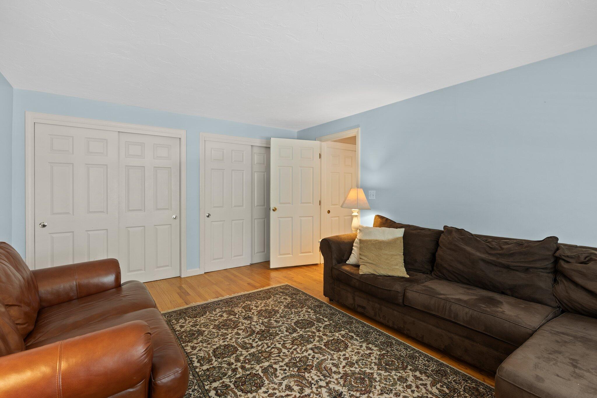 131 Clamshell Cove Road Cotuit, MA 02635 - Photo 31 of 67 a living room with furniture and a rug