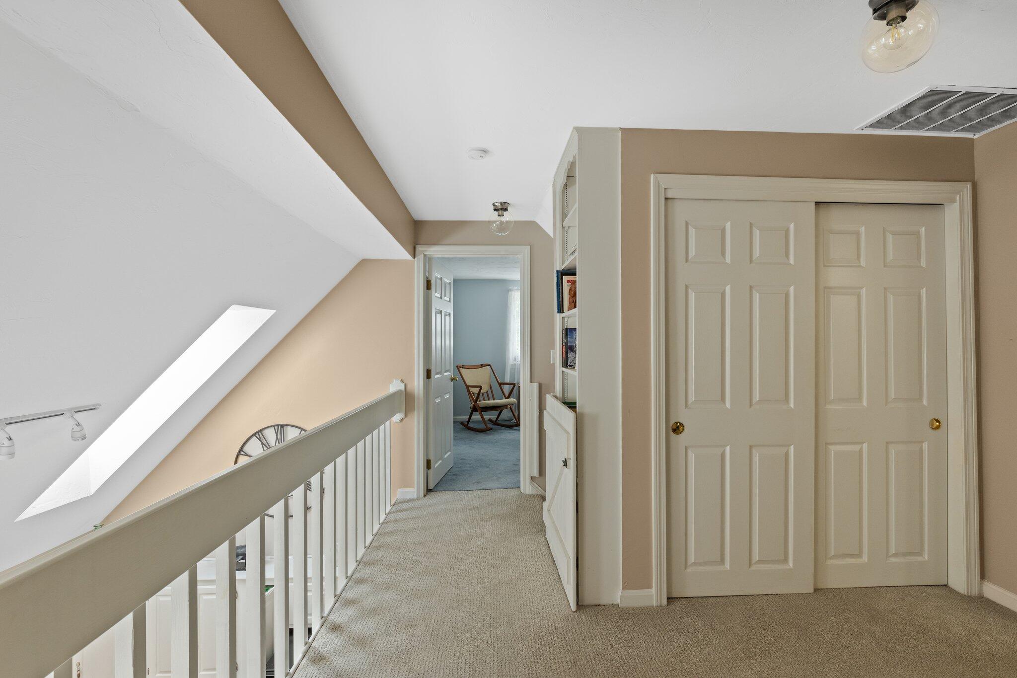 131 Clamshell Cove Road Cotuit, MA 02635 - Photo 34 of 67 a view of a hallway with a livingroom and stairs