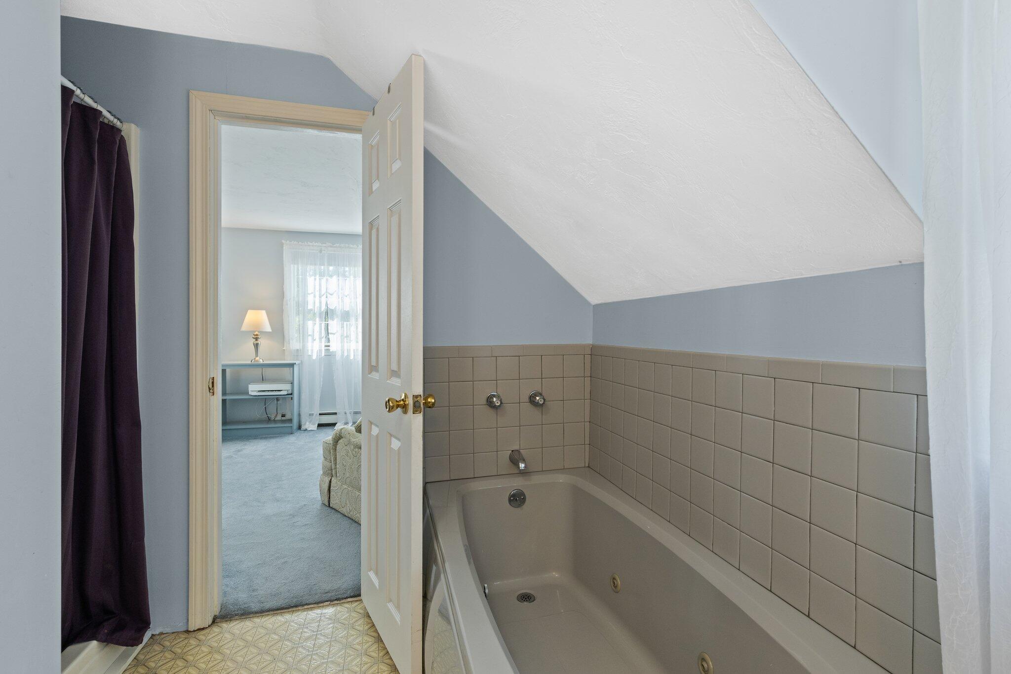 131 Clamshell Cove Road Cotuit, MA 02635 - Photo 39 of 67 a bathroom with a bathtub and a shower