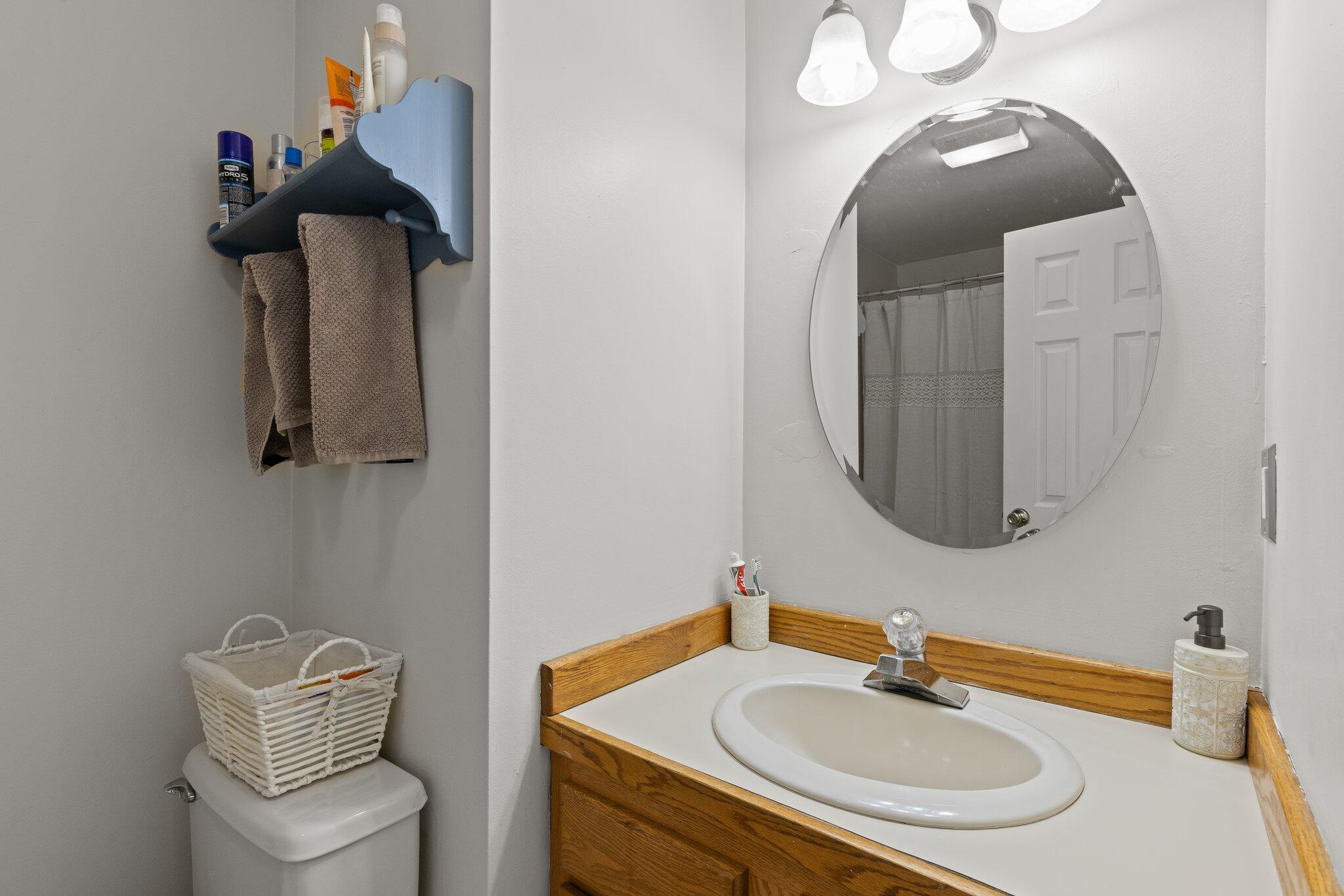 131 Clamshell Cove Road Cotuit, MA 02635 - Photo 44 of 67 a bathroom with a sink and a mirror