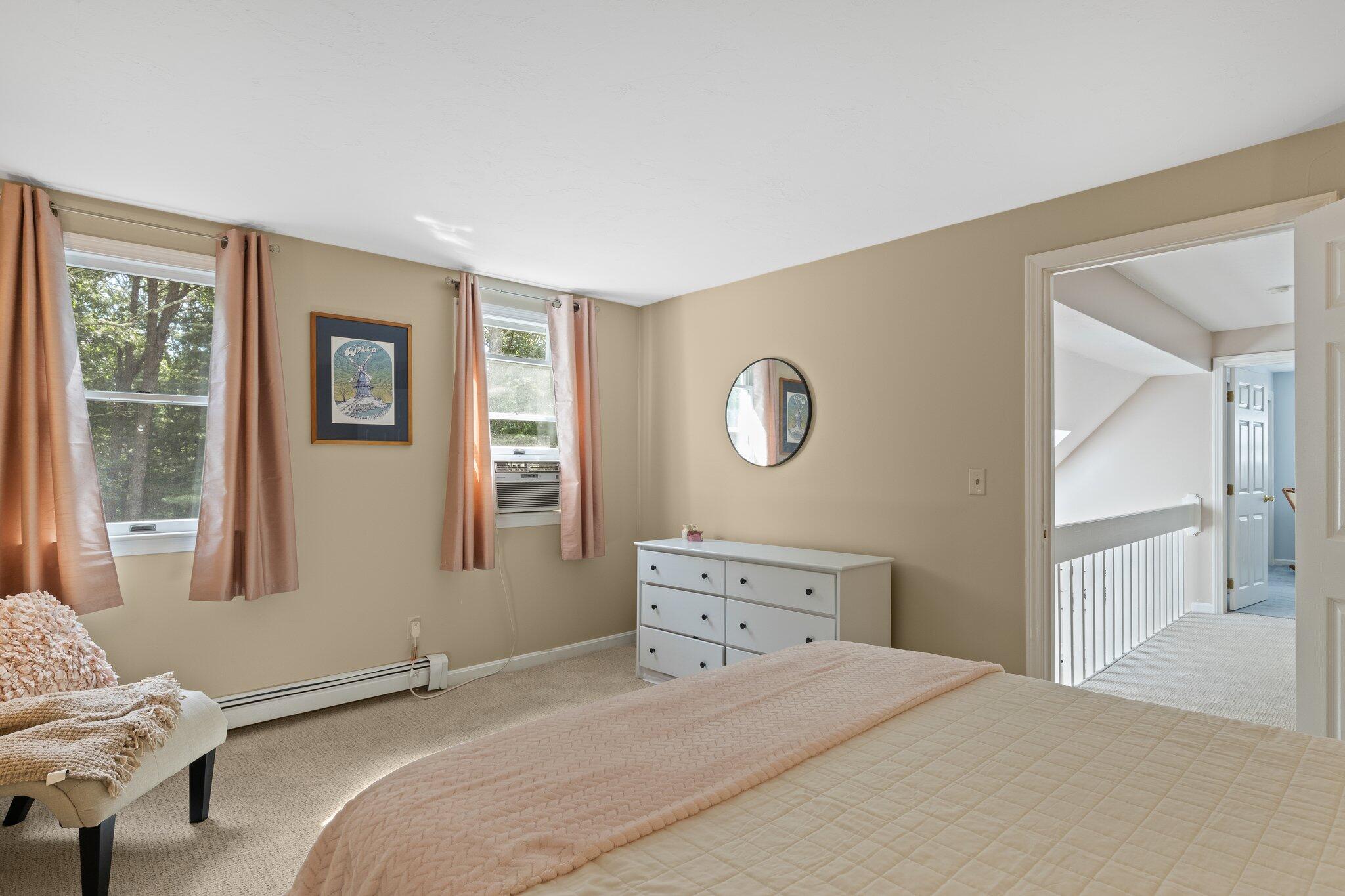 131 Clamshell Cove Road Cotuit, MA 02635 - Photo 47 of 67 a bedroom with a bed and wooden floor