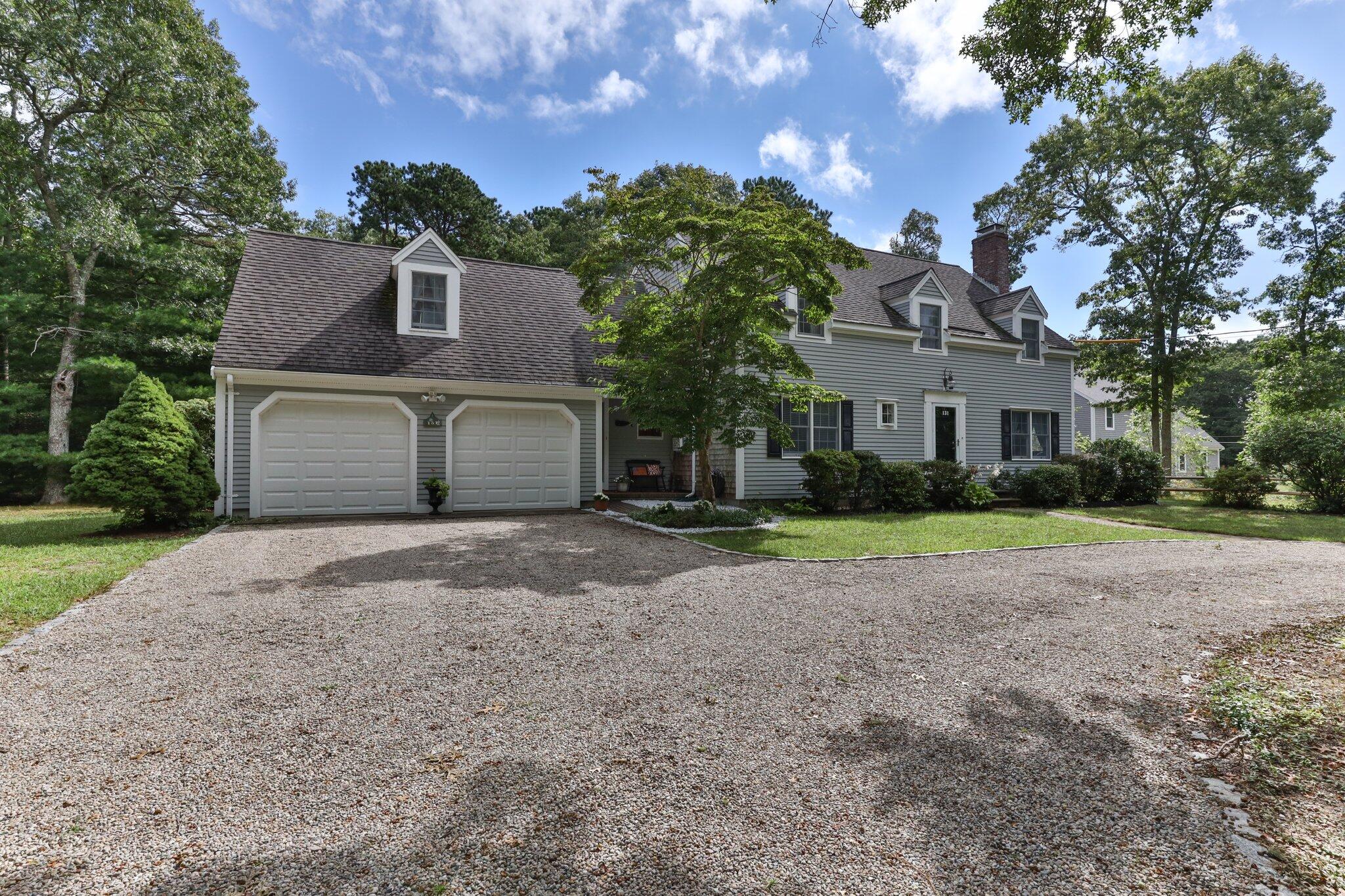131 Clamshell Cove Road Cotuit, MA 02635 - Photo 6 of 67 a house view with a garden space