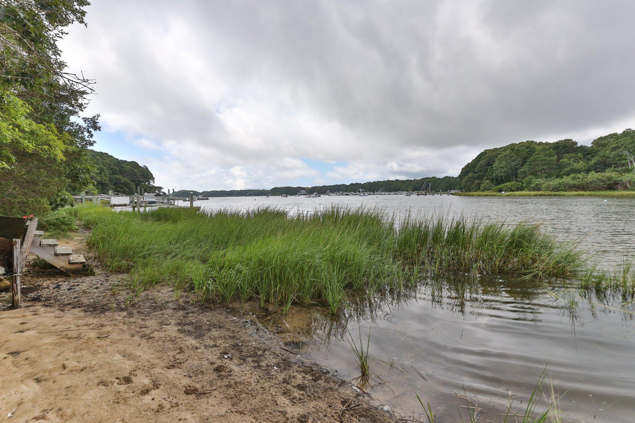 131 Clamshell Cove Road Cotuit, MA 02635 - Photo 63 of 67 a view of a lake with outdoor space