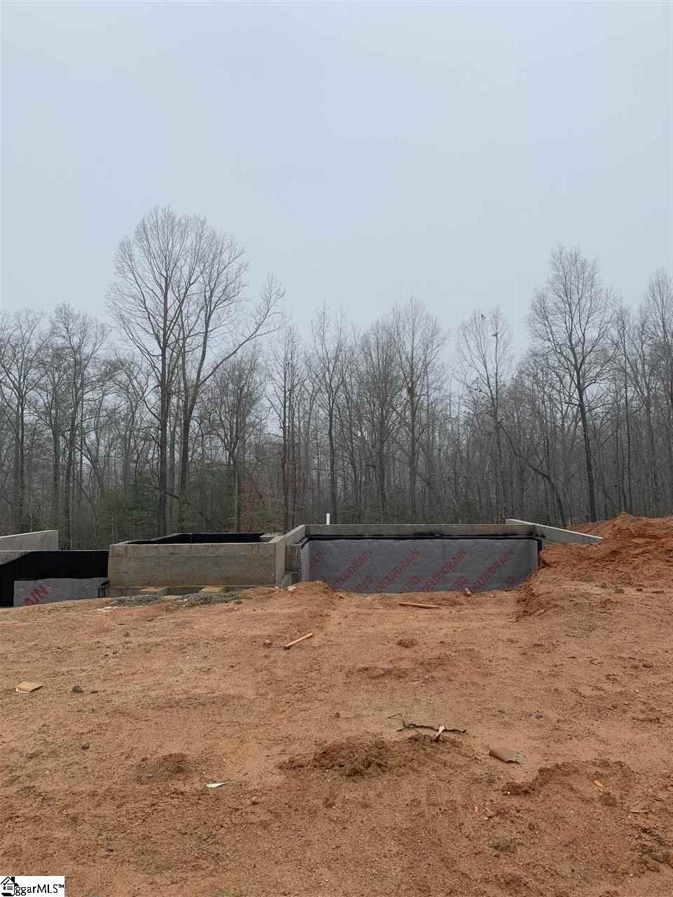 Foundation is in on this lovely wooded lot!
