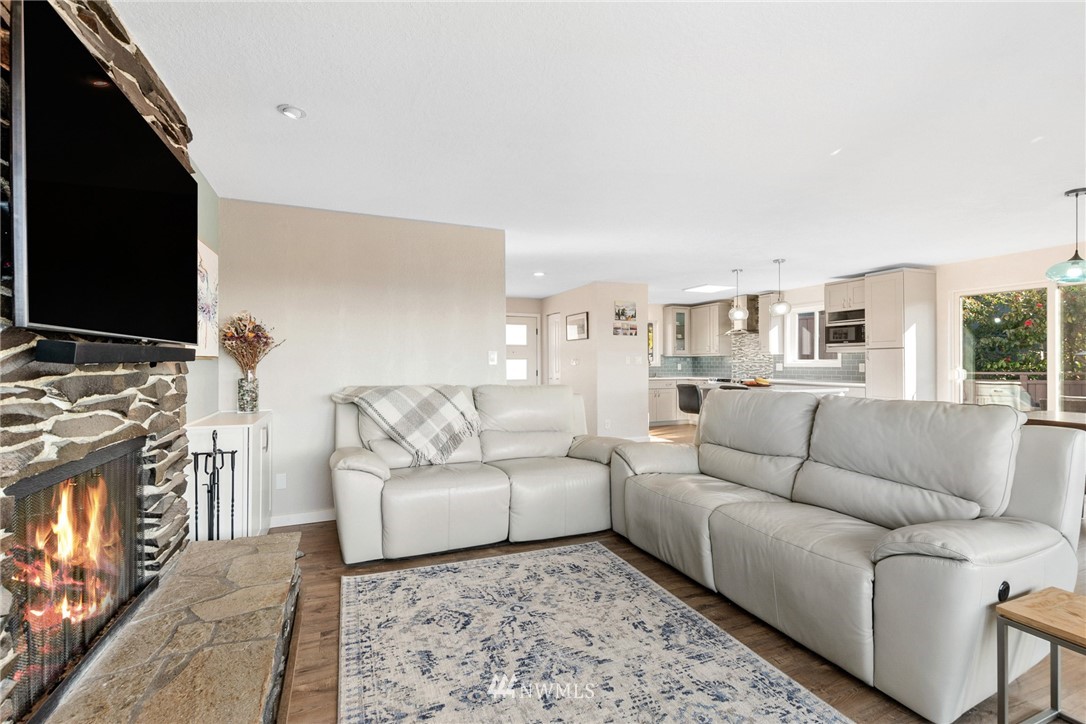 9337 45th Avenue Southwest Seattle, WA 98136 - Photo 14 of 30 a living room with furniture and a flat screen tv