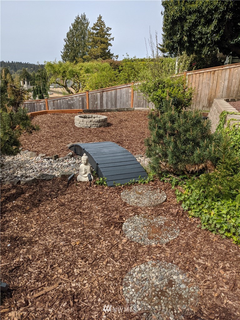 9337 45th Avenue Southwest Seattle, WA 98136 - Photo 28 of 30 a view of a backyard with plants and trees