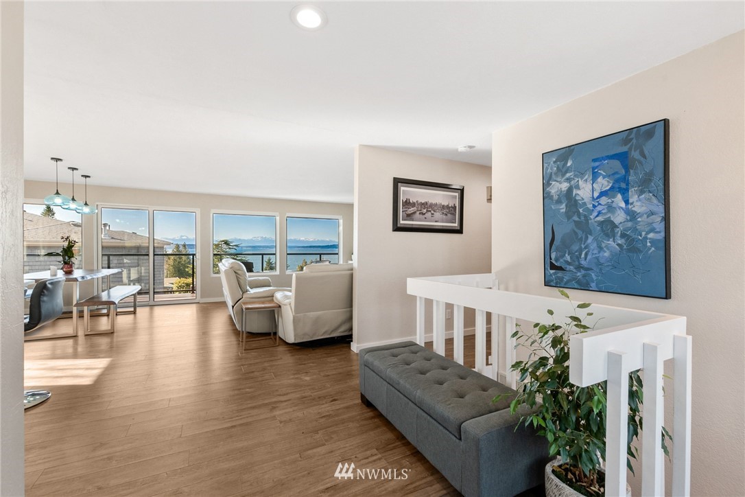 9337 45th Avenue Southwest Seattle, WA 98136 - Photo 3 of 30 a living room with furniture and a chandelier