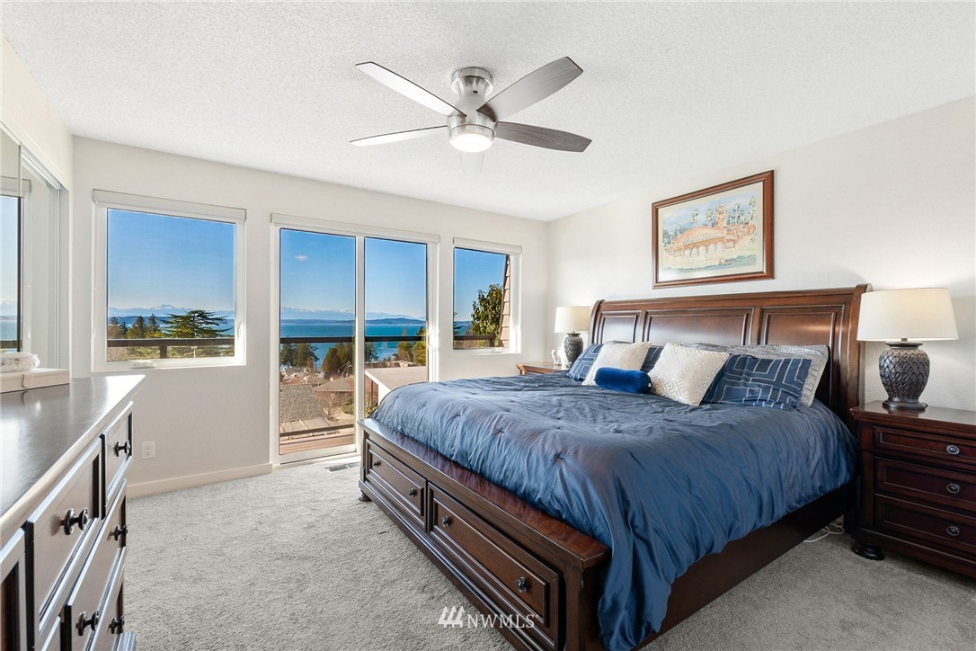 9337 45th Avenue Southwest Seattle, WA 98136 - Photo 5 of 30 a bedroom with a bed and window