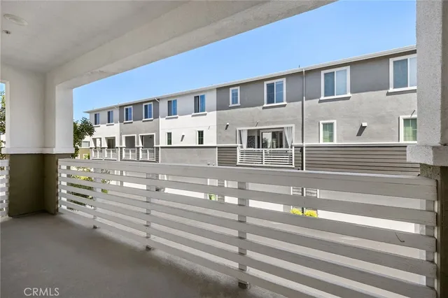 a view of an empty room with windows