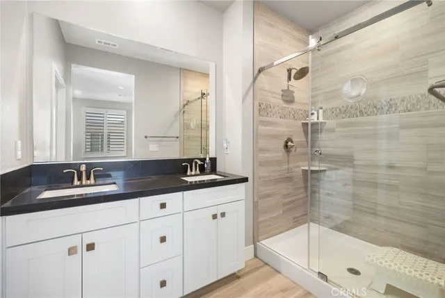 a view of walk in closet with clothes