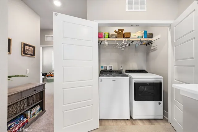 a living room with furniture and a book shelf