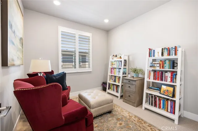 a room with furniture and a book shelf