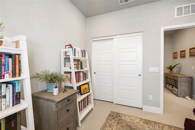 a bedroom with furniture and a window