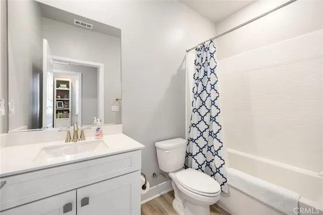 front view of a brick house with a large window