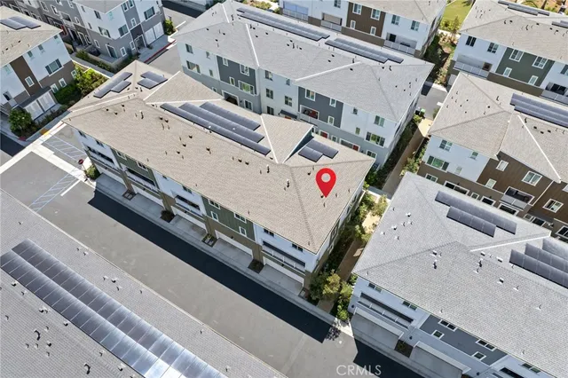 an aerial view of a city with lawn chairs