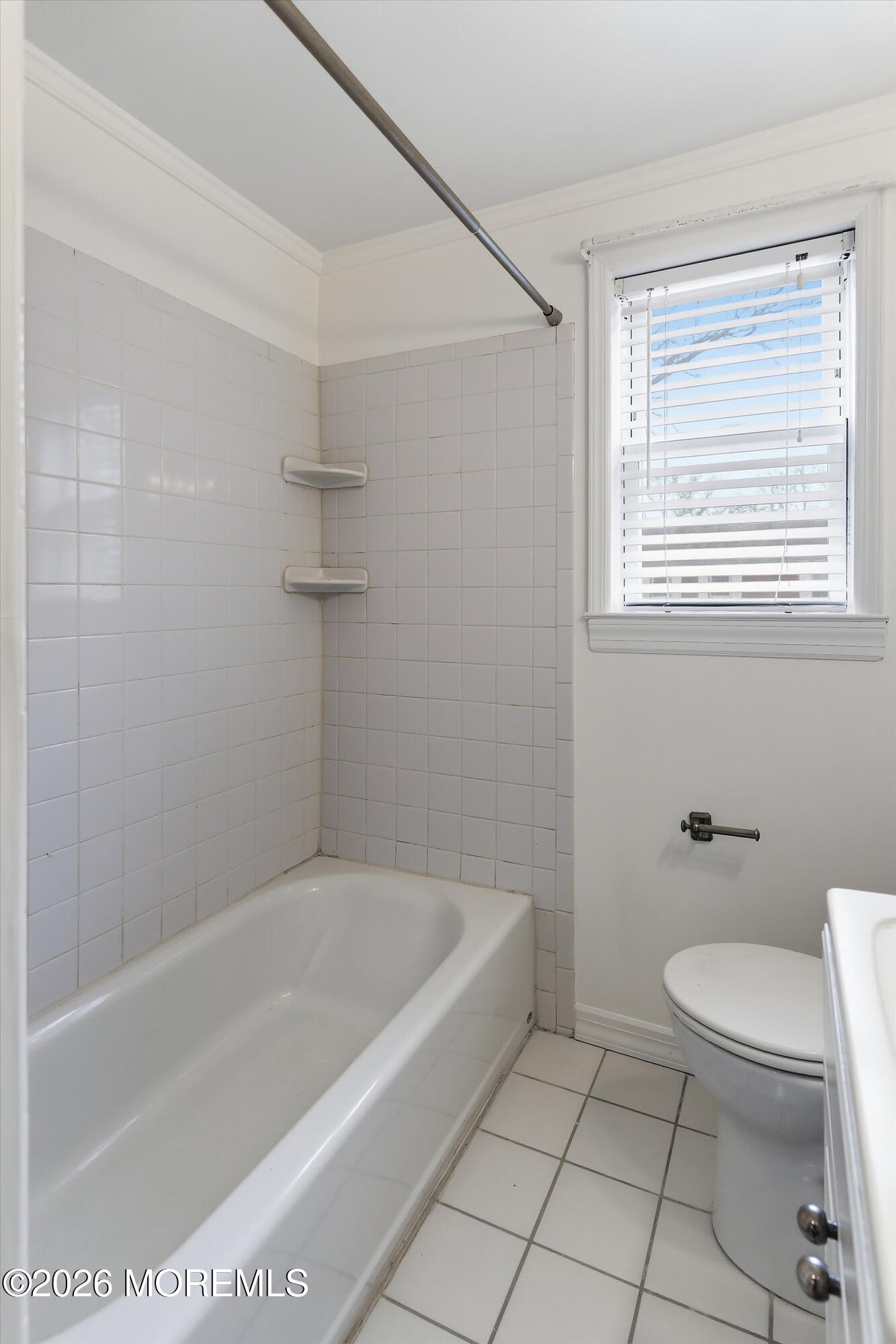 83 Manor Drive Red Bank, NJ 07701 - Photo 13 of 16 a white bath tub sitting next to a toilet