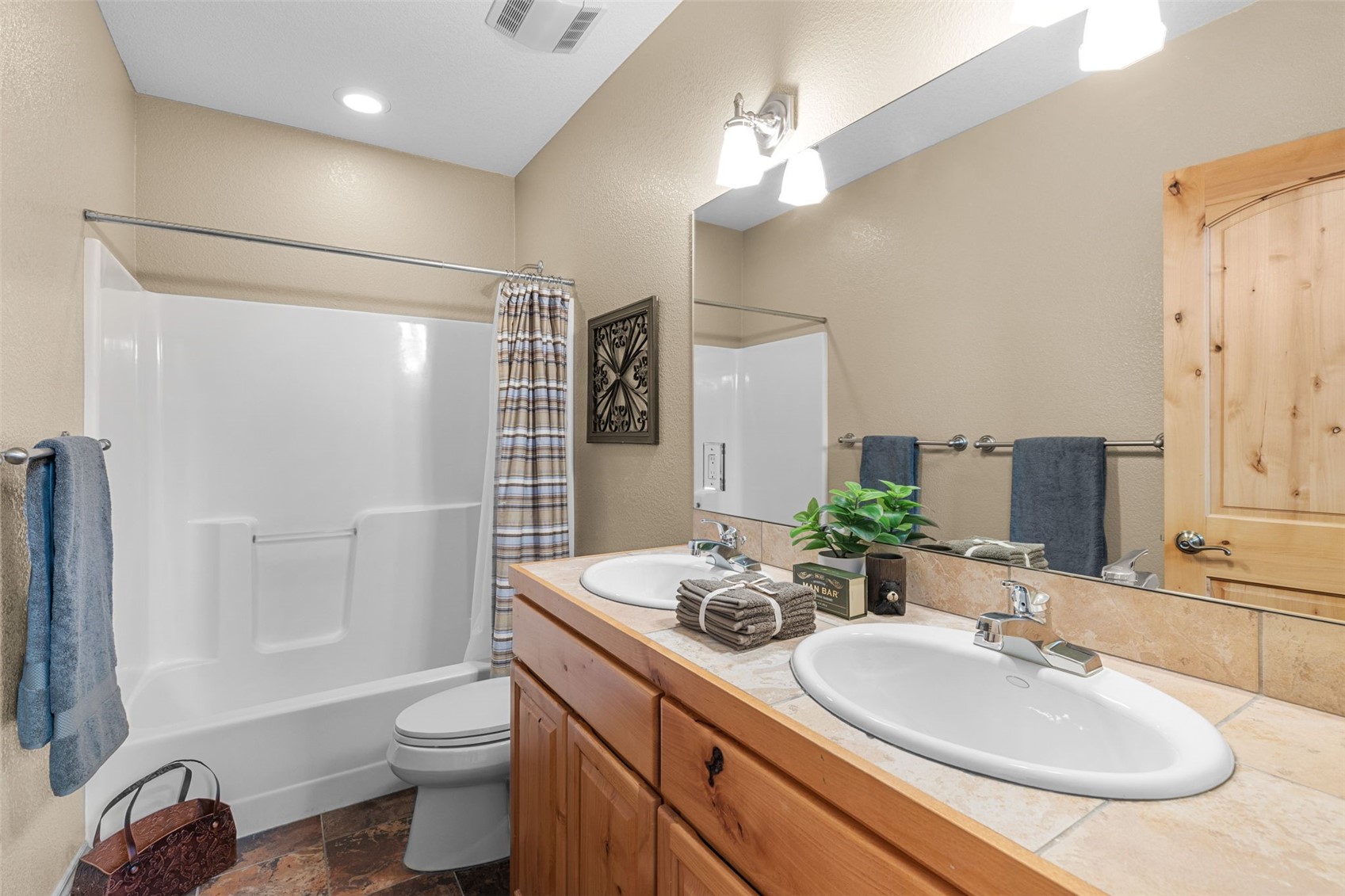 91795 Ryan Gulch Road Silverthorne, CO 80498 - Photo 38 of 50 a bathroom with double sink and a mirror