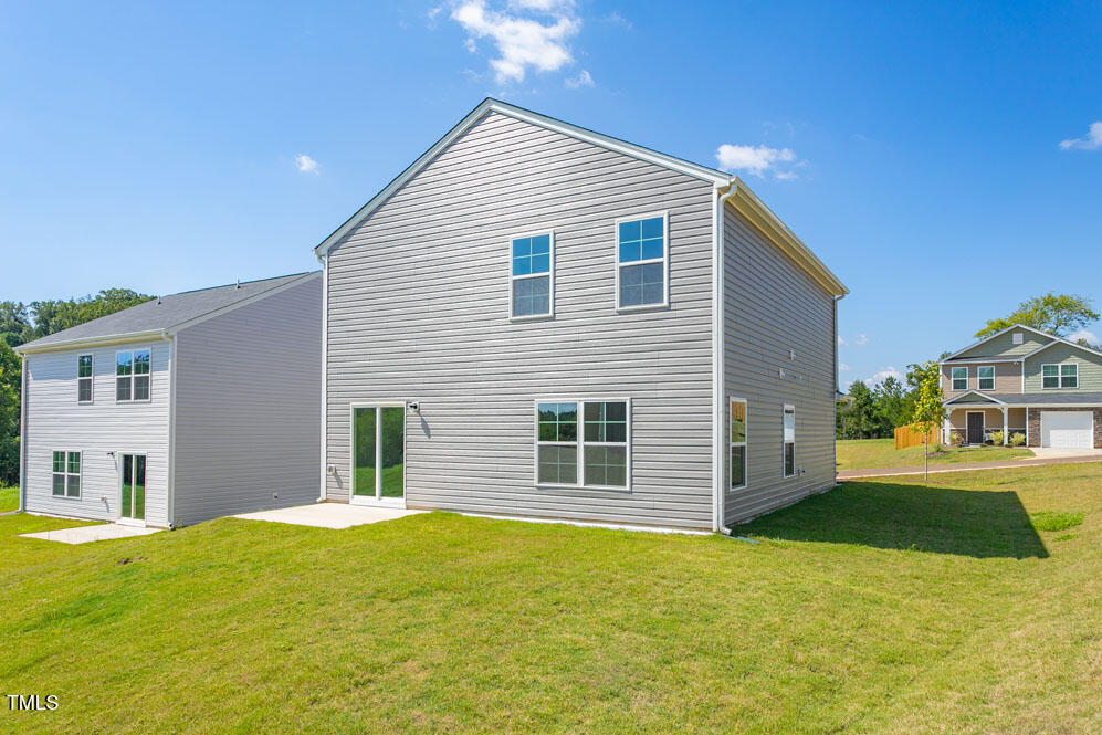 6048 Sodium Street Raleigh, NC 27610 - Photo 27 of 30 a front view of a house with a yard